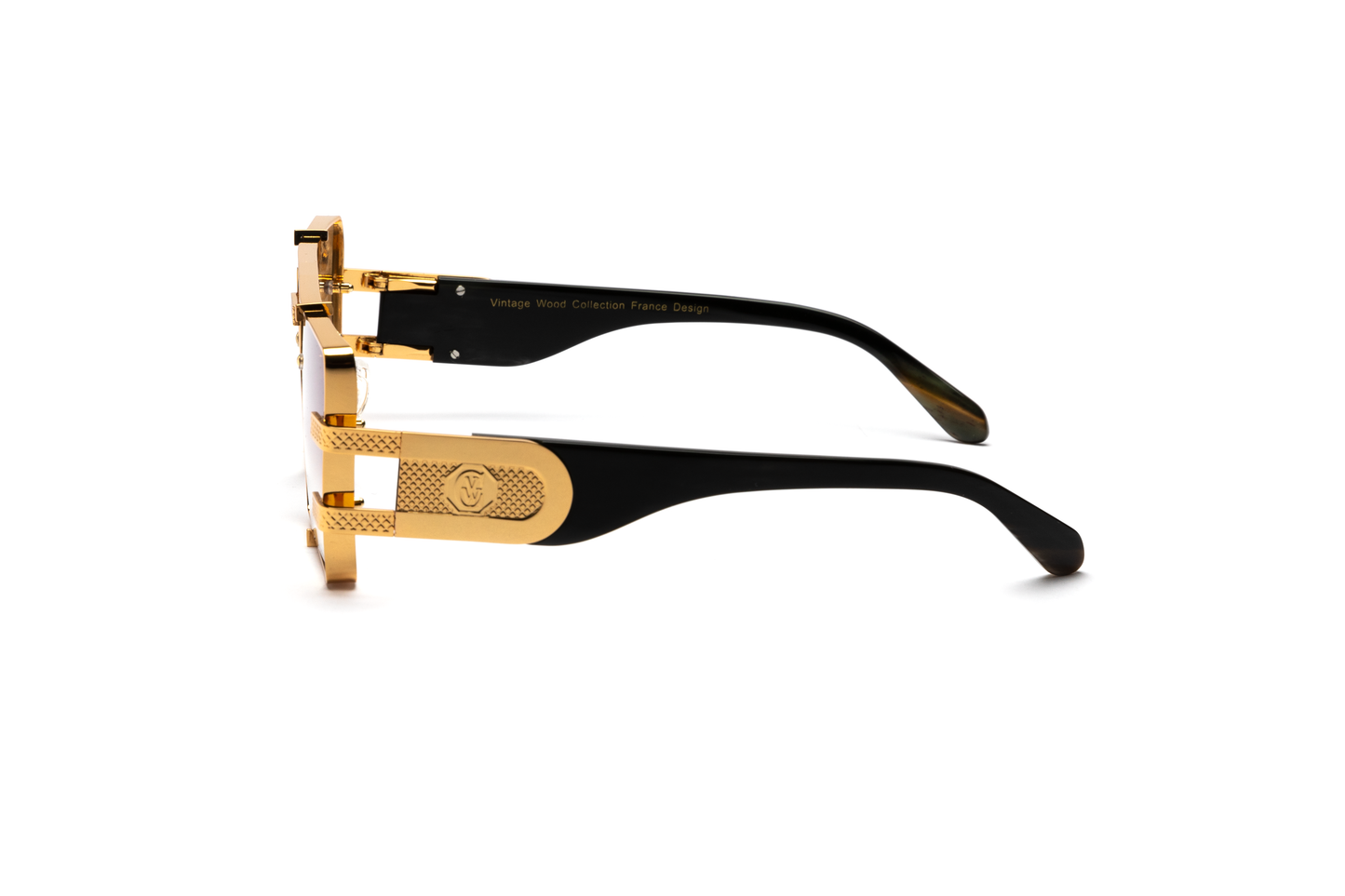 Side-angle product image of black buffalo horn sunglasses from Vintage Wood Collection, featuring 24-karat gold detailing and gradient brown lenses. The sunglasses have a sleek, street-style design and are displayed on a clean white background.