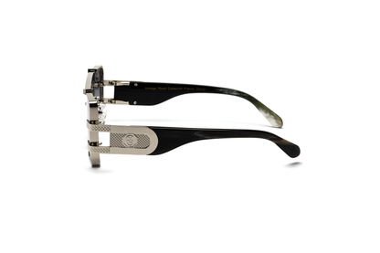 Side-angle product image of black and silver buffalo horn sunglasses from Vintage Wood Collection, featuring sleek metal detailing and gradient grey lenses. The sunglasses have a modern, street-style design and are displayed on a clean white background.