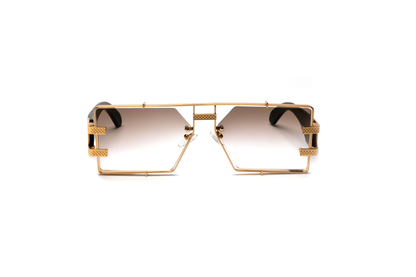 Front-angle product image of black wood and 24-karat gold sunglasses from Vintage Wood Collection, featuring gradient brown lenses and a sleek metal frame. The sunglasses have a bold, street-style design and are displayed on a clean white background.