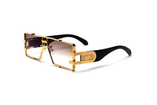 Side-angle product image of black wood and 24-karat gold sunglasses from Vintage Wood Collection, featuring gradient brown lenses and a sleek metal frame. The sunglasses have a bold, street-style design and are displayed on a clean white background.