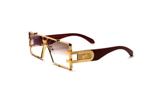 Side-angle product image of brown wood and 24-karat gold sunglasses from Vintage Wood Collection, featuring gradient brown lenses and a refined metal frame. The sunglasses have a polished, street-style design and are displayed on a clean white background.