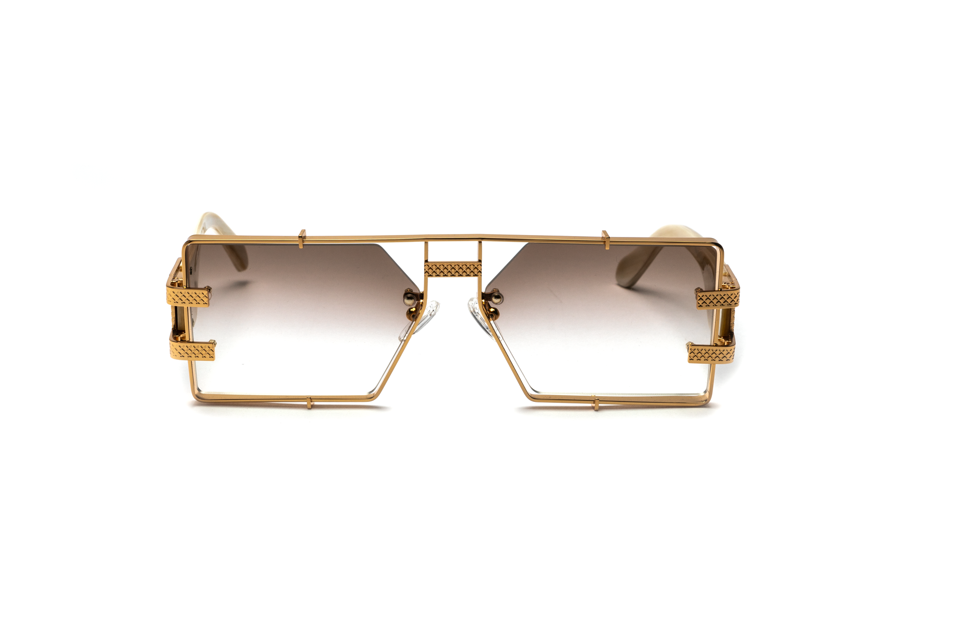 Front view of the Pinnacle Frame sunglasses highlighting the white buffalo horn frame, 24-carat gold detailing, and brown gradient lenses, displayed on a white background.