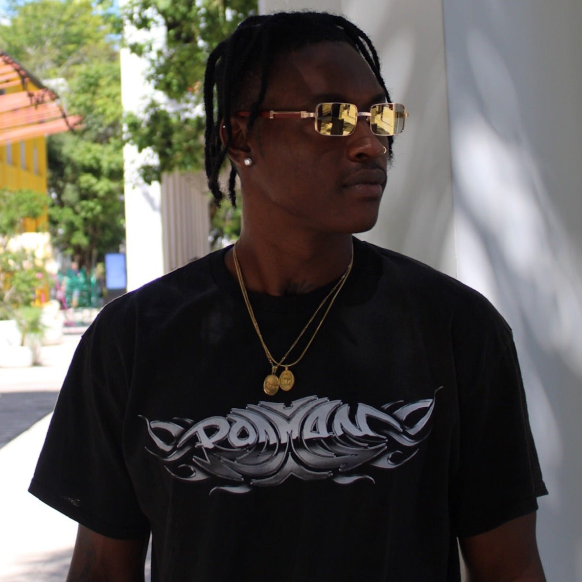 Model wearing the "Brigade" full rim wood sunglasses by Vintage Wood Collection in the Design District Miami